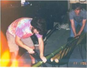 Left to right: Pledges Daniel Studdard and Carleson Dozier cut bamboo for the bamboo hut and the bamboo walls for the 1st Annual Shipwreck Party, 2006.